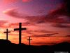 Photo of three crosses silhouetted against a dark sunset, crucifixion